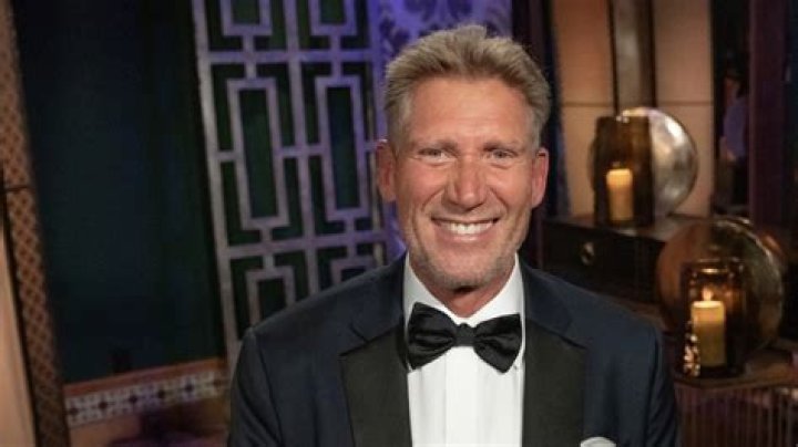 Gerry Turner is seen smiling at the camera while wearing a tuxedo.