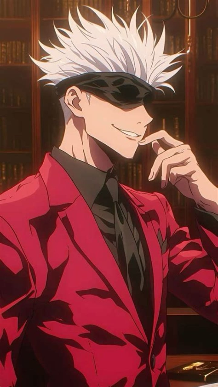 Jojo in a red jacket and blue tie