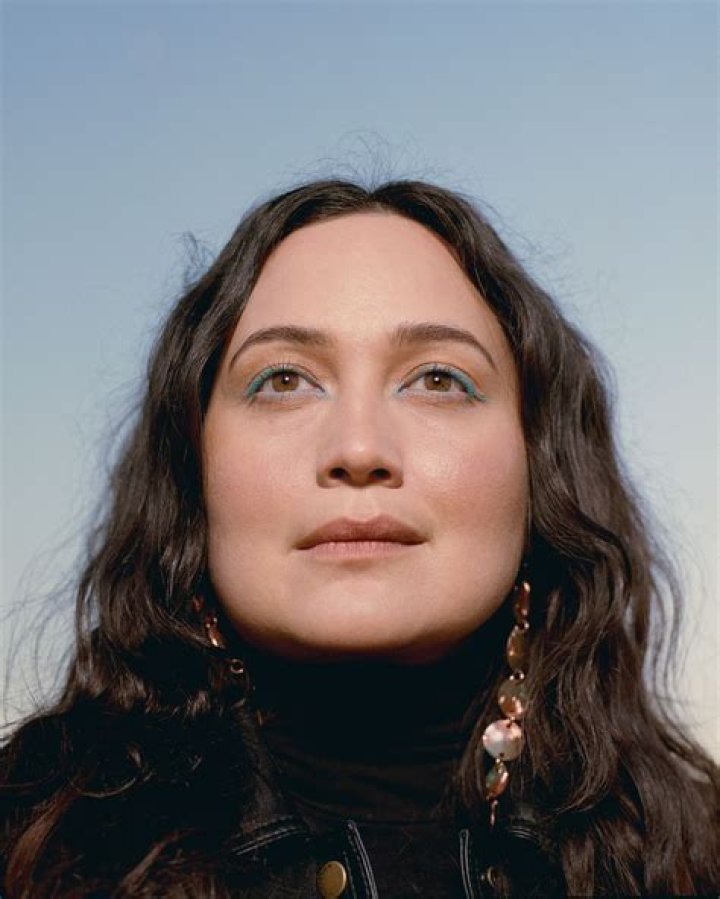 Lily Gladstone is looking off in Reservation Dogs.