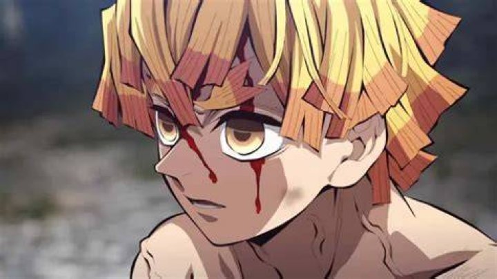Zenitsu looking afraid while he is shaking